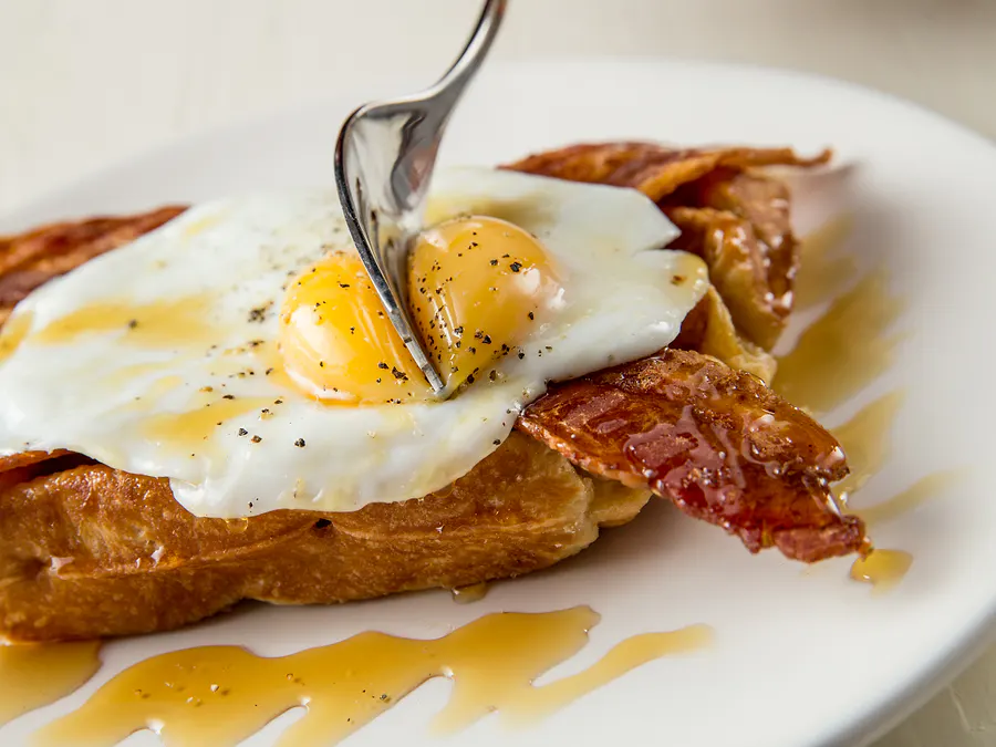 The Self-Fulfilling Prophecy — waffle with sunny side up egg, bacon and maple syrup